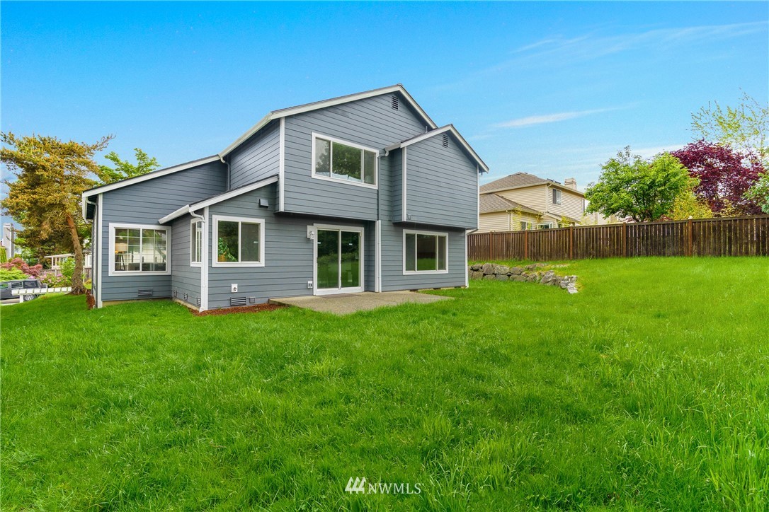 19104 113th Way Southeast Renton, WA 98055 - Photo 23 of 30 a front view of a house with a garden