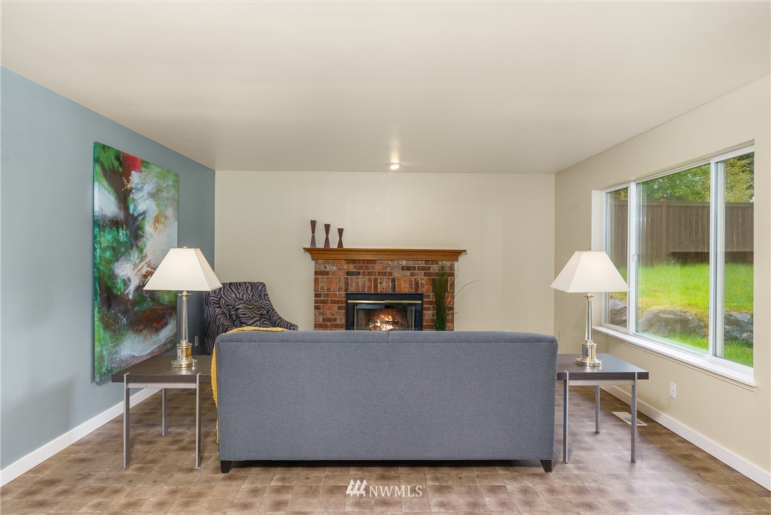 19104 113th Way Southeast Renton, WA 98055 - Photo 10 of 30 a living room with furniture and a lamp