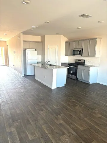 a large kitchen with a lot of counter space