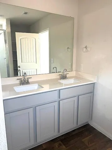 a bathroom with a glass shower door