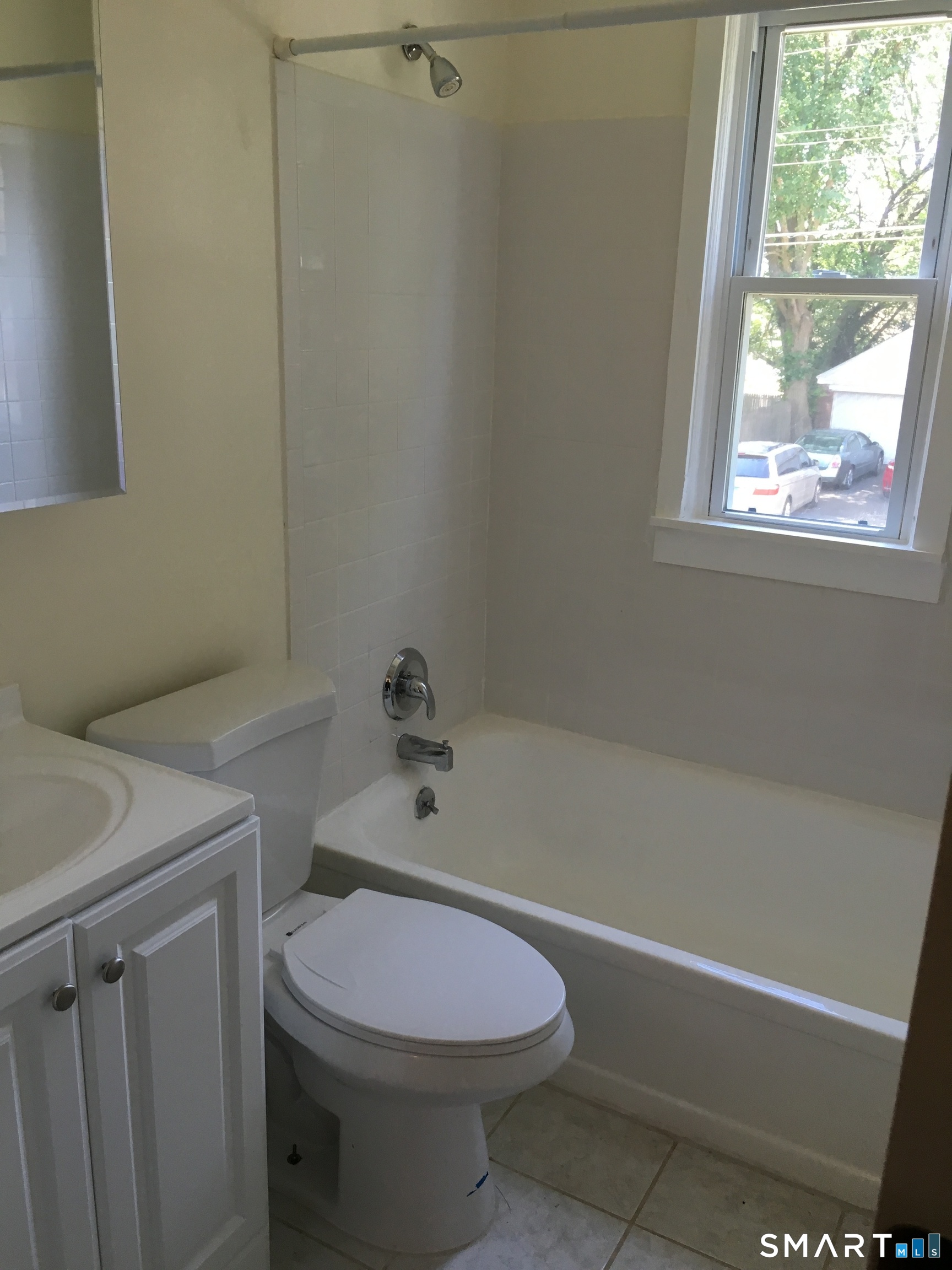 8 High Ridge Drive Bridgeport, CT 06606 - Photo 5 of 6 a bathroom with a sink a toilet and a bathtub