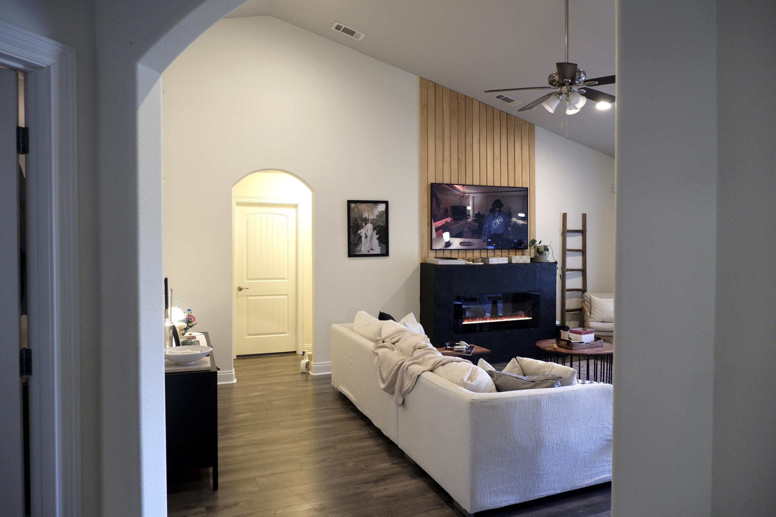6841 Nelson Street Navarre, FL 32566 - Photo 5 of 14 a living room with furniture and a chandelier