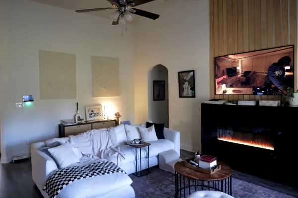 a living room with furniture and a fireplace