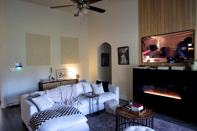 a living room with furniture and a fireplace