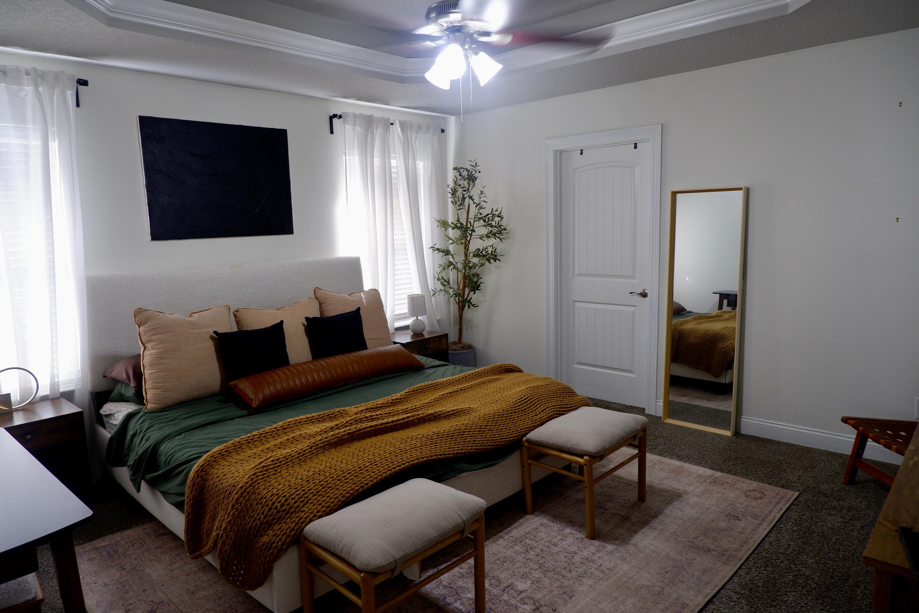 6841 Nelson Street Navarre, FL 32566 - Photo 7 of 14 a bedroom with a bed a desk and chair