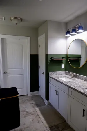 a kitchen with a sink and refrigerator