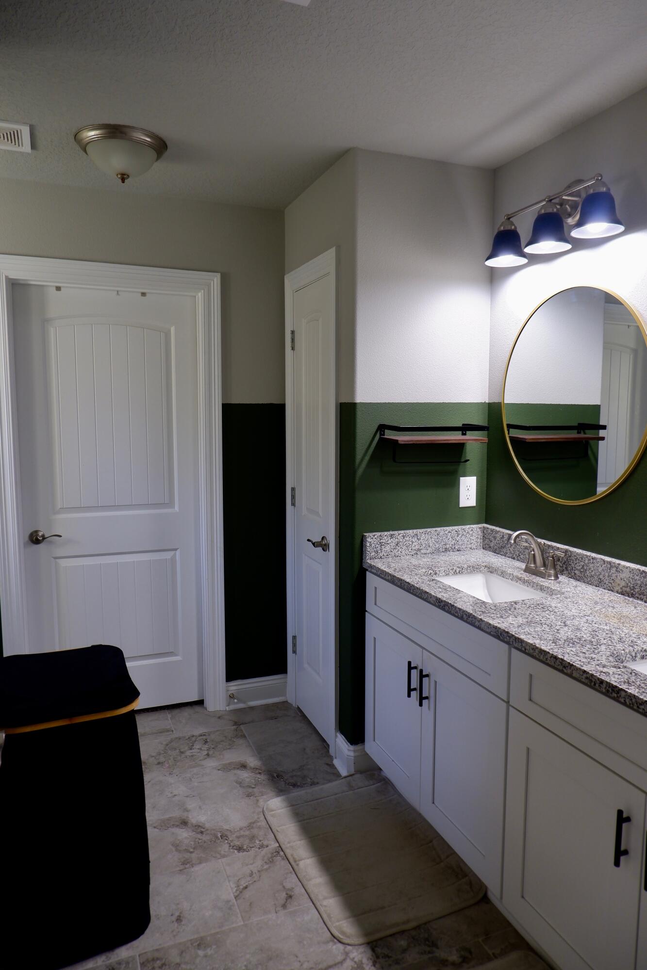 6841 Nelson Street Navarre, FL 32566 - Photo 9 of 14 a kitchen with a sink and refrigerator