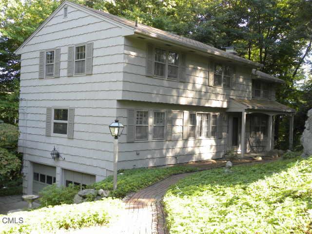 1 Seth Low Mountain Road Ridgefield, CT 06877 - Photo 1 of 1 a front view of a house with garden