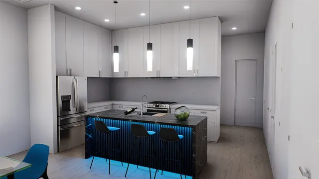 a kitchen with stainless steel appliances granite countertop a stove a sink and a microwave