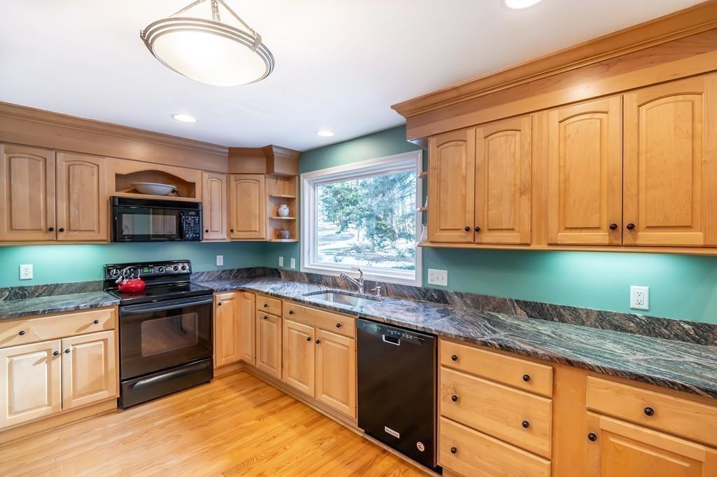 15 Arcadia Road Andover, MA 01810 - Photo 11 of 42 a kitchen with granite countertop a stove sink and cabinets