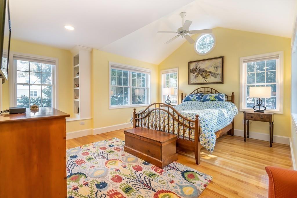 15 Arcadia Road Andover, MA 01810 - Photo 19 of 42 a bedroom with a bed and wooden floor
