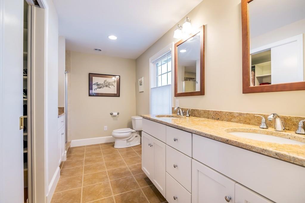 15 Arcadia Road Andover, MA 01810 - Photo 23 of 42 a spacious bathroom with a granite countertop sink mirror and a toilet