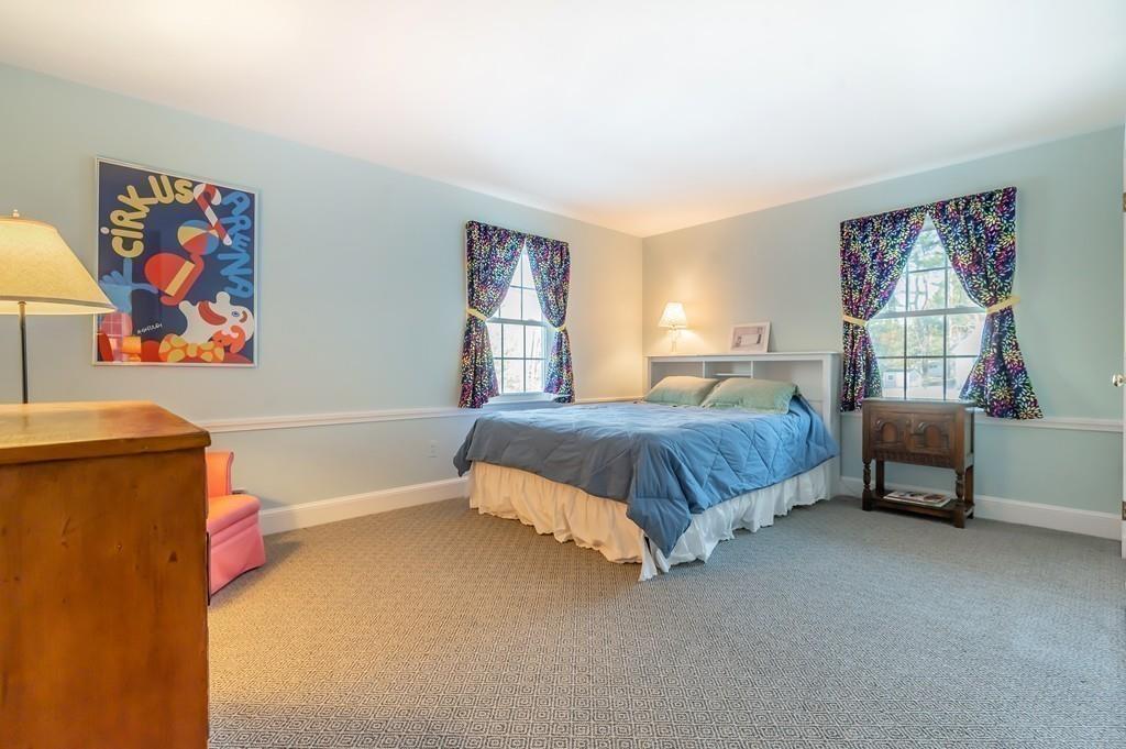 15 Arcadia Road Andover, MA 01810 - Photo 31 of 42 a bedroom with a bed and a couch