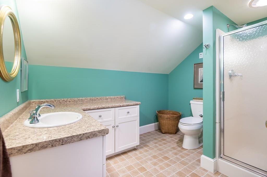 15 Arcadia Road Andover, MA 01810 - Photo 32 of 42 a bathroom with a granite countertop toilet sink and mirror