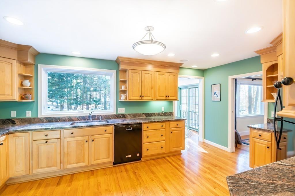 15 Arcadia Road Andover, MA 01810 - Photo 10 of 42 a large kitchen with stainless steel appliances granite countertop a sink and cabinets