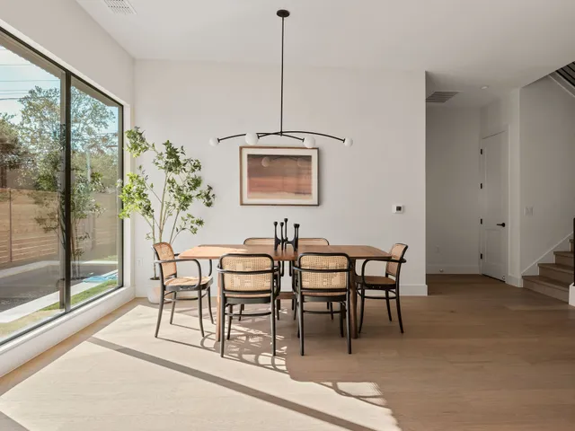 a view of a room with stairs and a chandelier