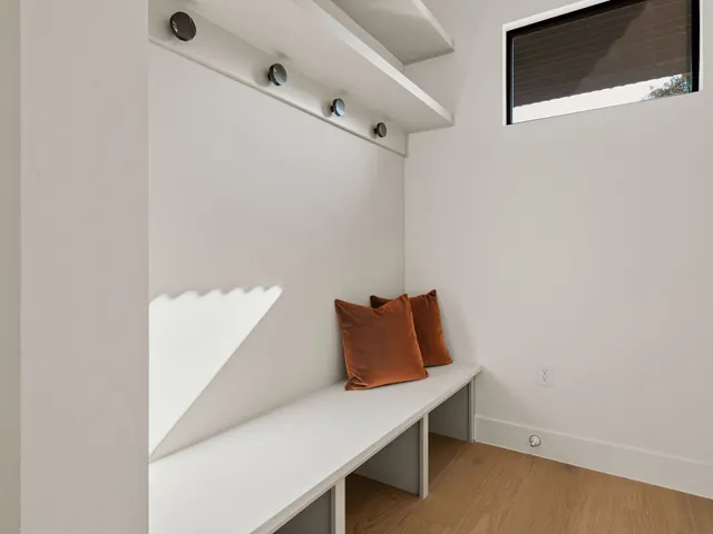 a bedroom with a large bed and a large window