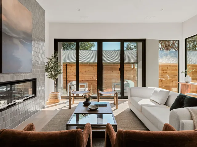 a kitchen that has a lot of cabinets and stainless steel appliances