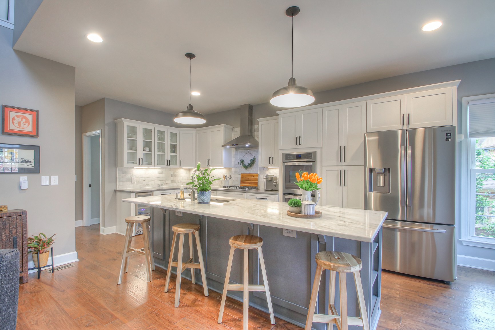 529 Crofton Park Lane Franklin, TN 37069 - Photo 14 of 59 a kitchen with stainless steel appliances a dining table chairs refrigerator and cabinets