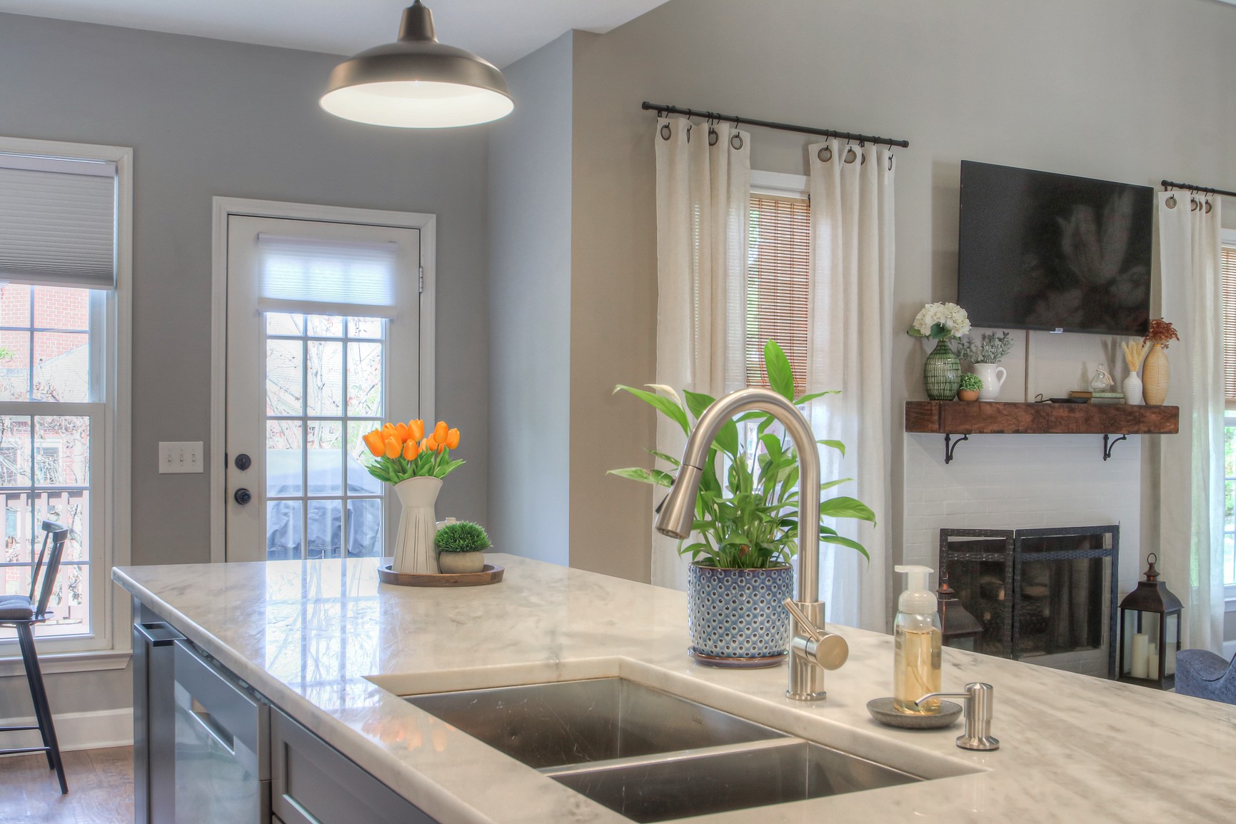 529 Crofton Park Lane Franklin, TN 37069 - Photo 20 of 59 a kitchen with a granite counter top a potted plant on the counter and a sink