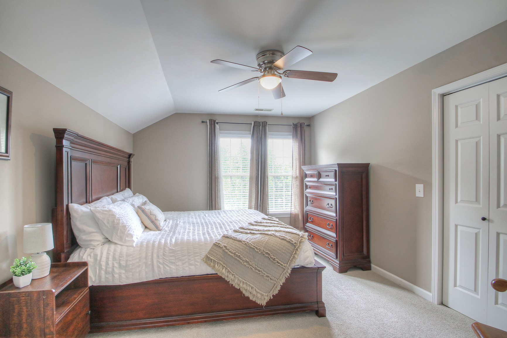 529 Crofton Park Lane Franklin, TN 37069 - Photo 33 of 59 a bedroom with a bed and a chandelier