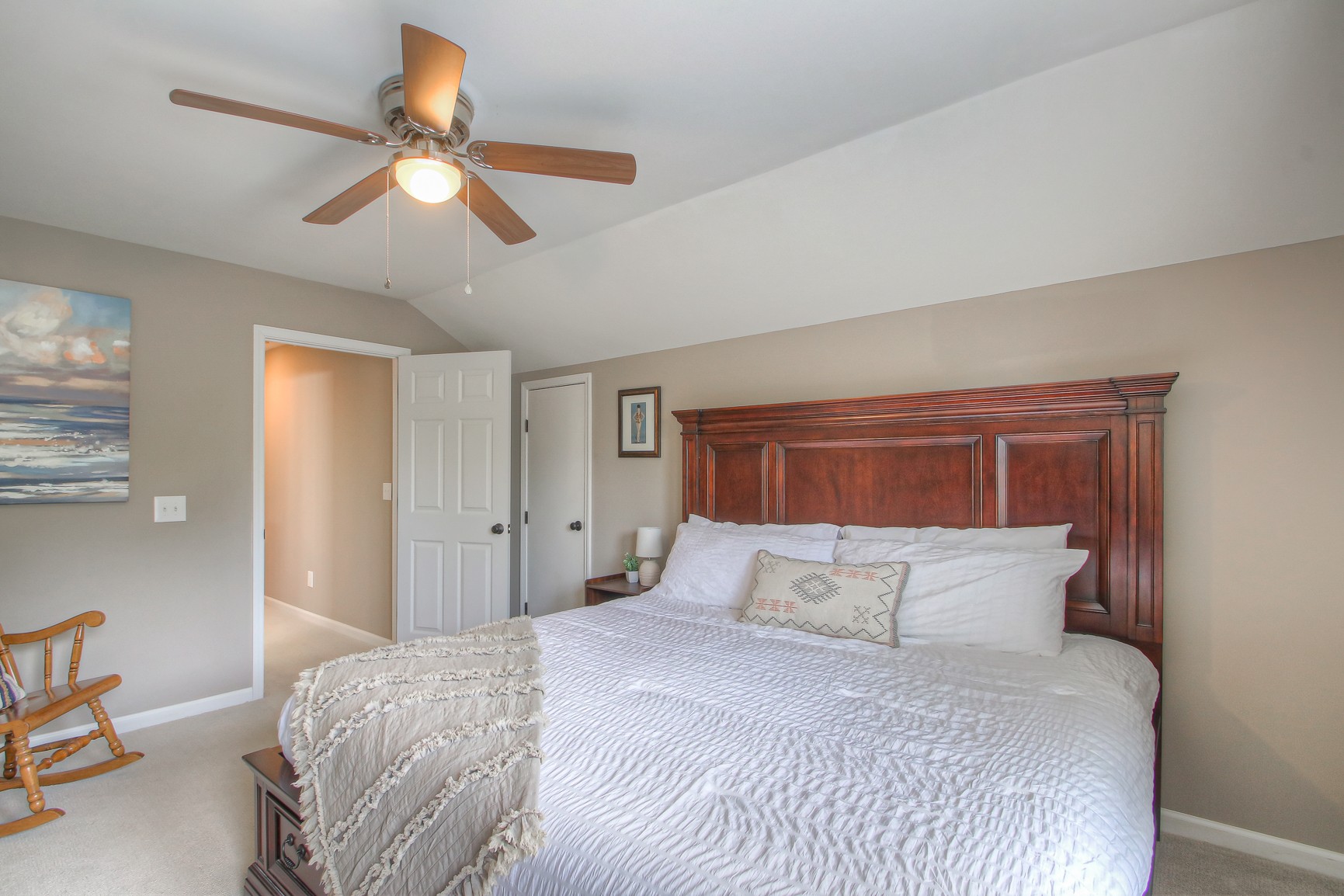 529 Crofton Park Lane Franklin, TN 37069 - Photo 34 of 59 a bedroom with a large bed and a chandelier