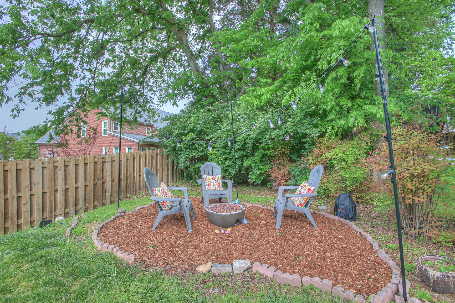 529 Crofton Park Lane Franklin, TN 37069 - Photo 49 of 59 a view of a backyard with table and chairs and a small yard