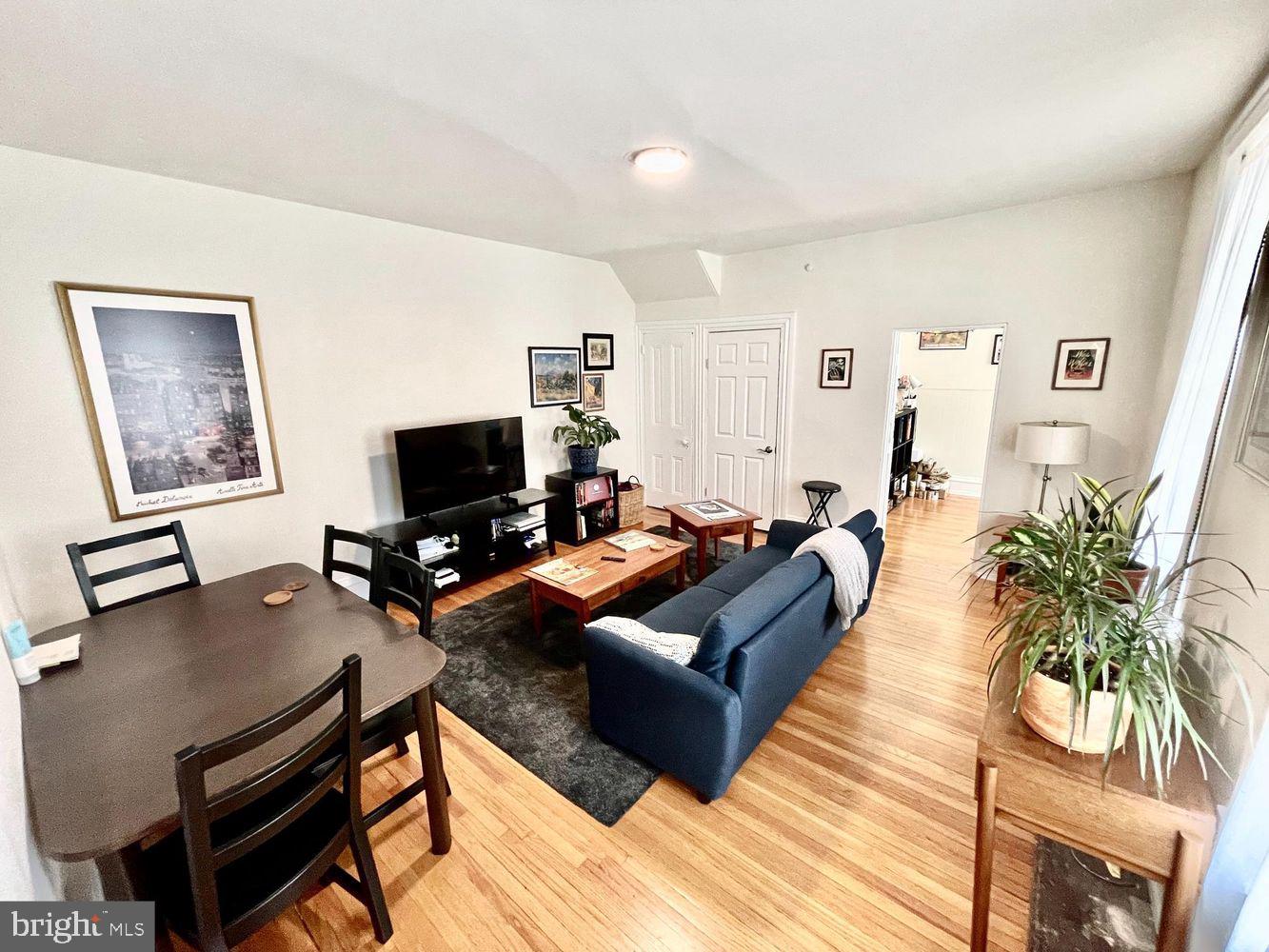 130 Green Lane, Unit 1 Philadelphia, PA 19127 - Photo 4 of 10 a living room with furniture a flat screen tv and a table