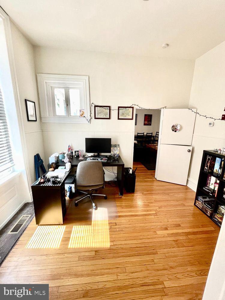 130 Green Lane, Unit 1 Philadelphia, PA 19127 - Photo 9 of 10 a living room with furniture and a flat screen tv