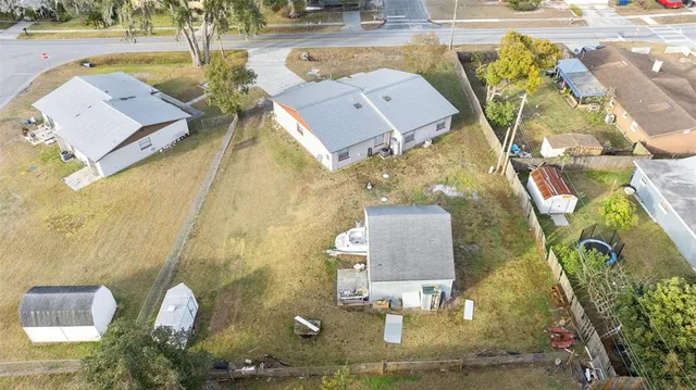 an aerial view of a house with a swimming pool