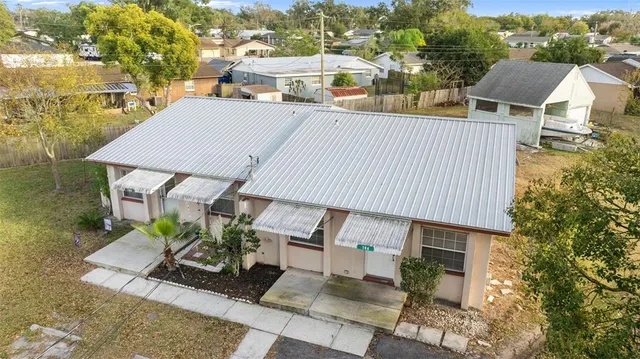 an aerial view of residential building with parking space