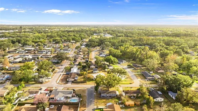 an aerial view of residential building with parking space