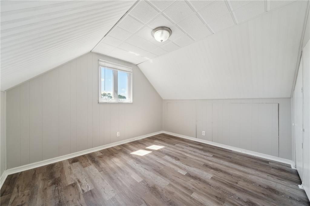 357 Collins Drive Pittsburgh, PA 15235 - Photo 17 of 23 an empty room with wooden floor and windows