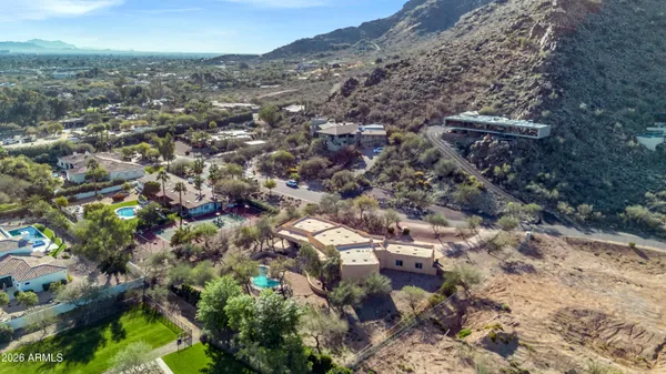 an aerial view of a house with a yard and garden