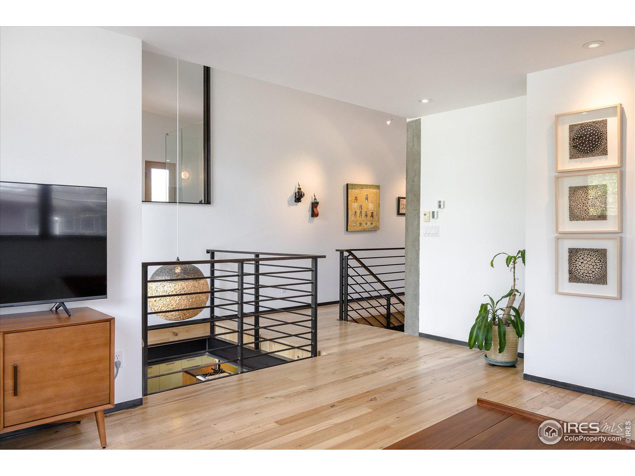 1740 Cedar Avenue Boulder, CO 80304 - Photo 16 of 40 a view of a livingroom with furniture and an empty room