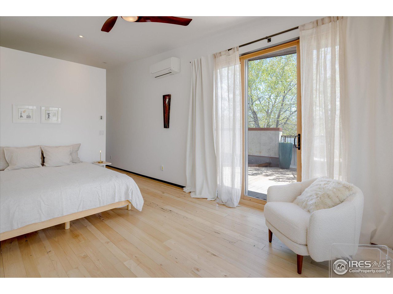 1740 Cedar Avenue Boulder, CO 80304 - Photo 19 of 40 a bedroom with a bed and a large window