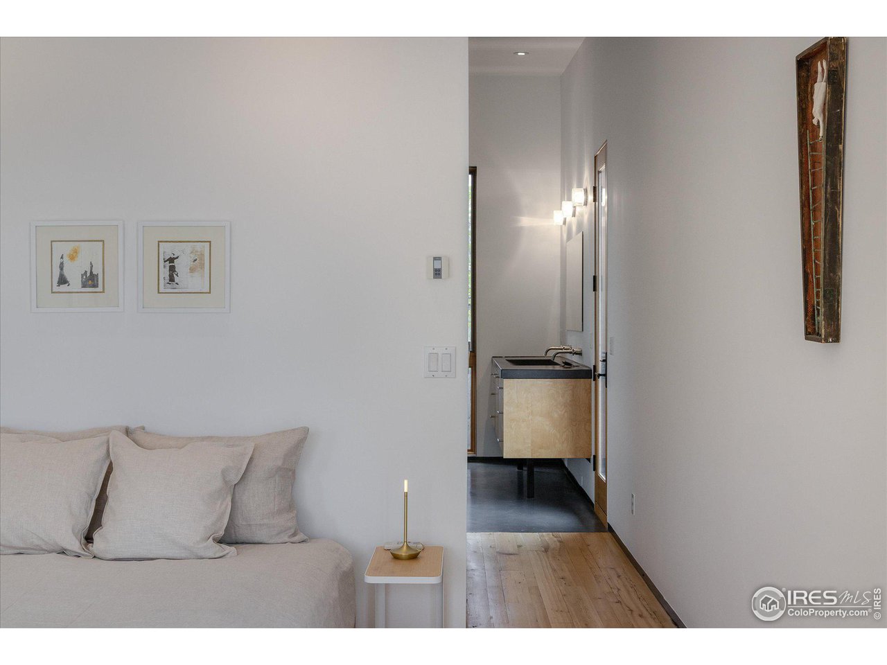 1740 Cedar Avenue Boulder, CO 80304 - Photo 21 of 40 a bedroom with a bed and a night stand