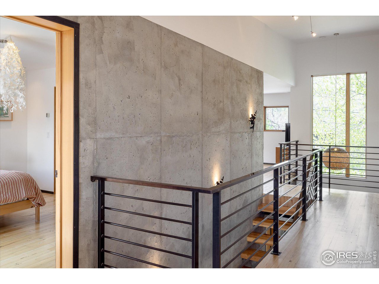 1740 Cedar Avenue Boulder, CO 80304 - Photo 26 of 40 a picture of a room with furniture and wooden floor