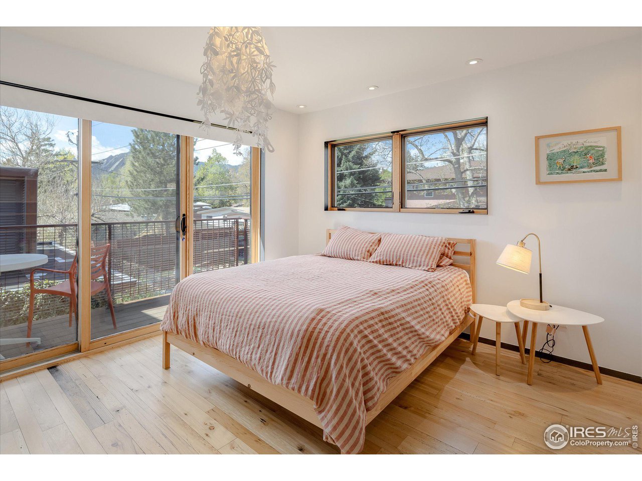 1740 Cedar Avenue Boulder, CO 80304 - Photo 28 of 40 a bedroom with a large bed and a large window