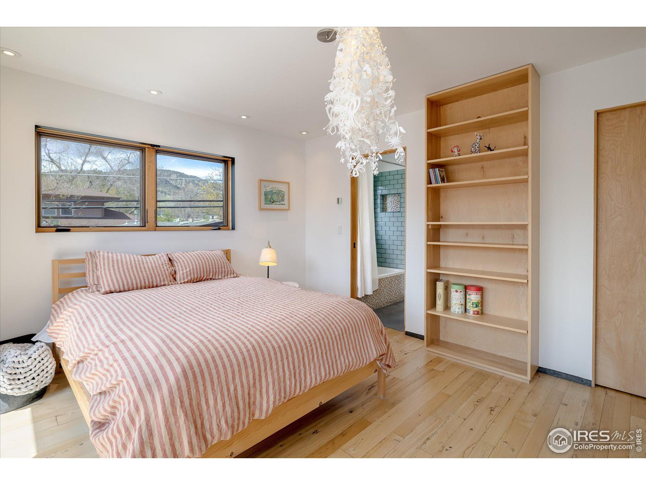 1740 Cedar Avenue Boulder, CO 80304 - Photo 29 of 40 a bedroom with a bed and a window