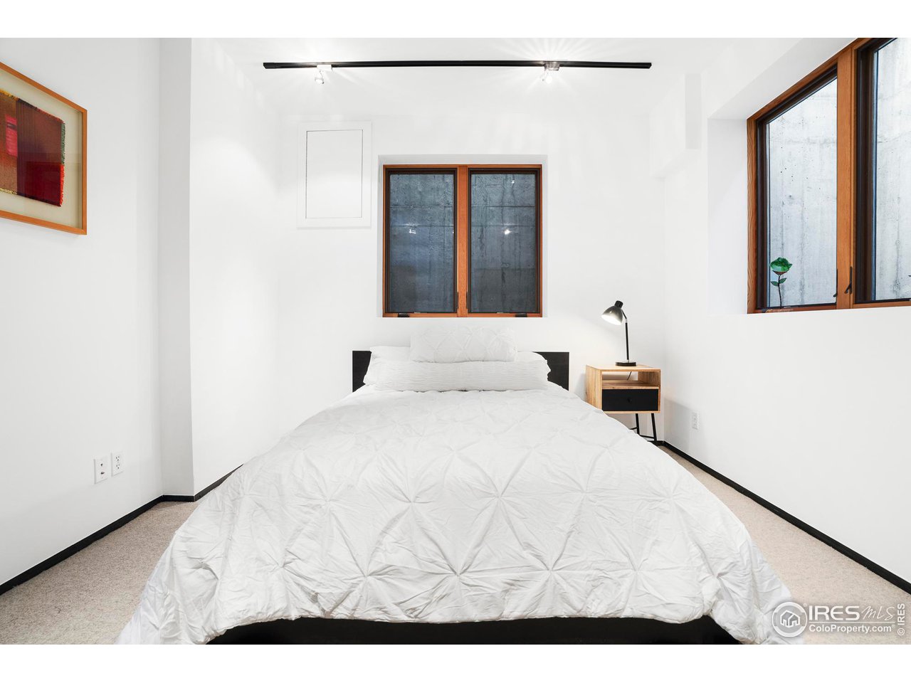 1740 Cedar Avenue Boulder, CO 80304 - Photo 33 of 40 a bedroom with a bed and a large window