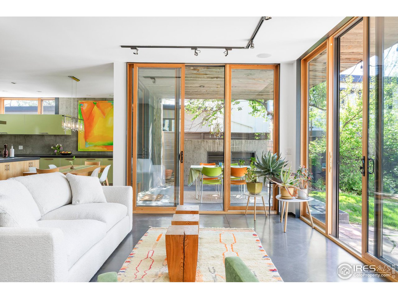 1740 Cedar Avenue Boulder, CO 80304 - Photo 7 of 40 a living room with couch and a floor to ceiling window