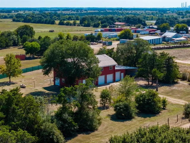 an aerial view of residential houses with outdoor space