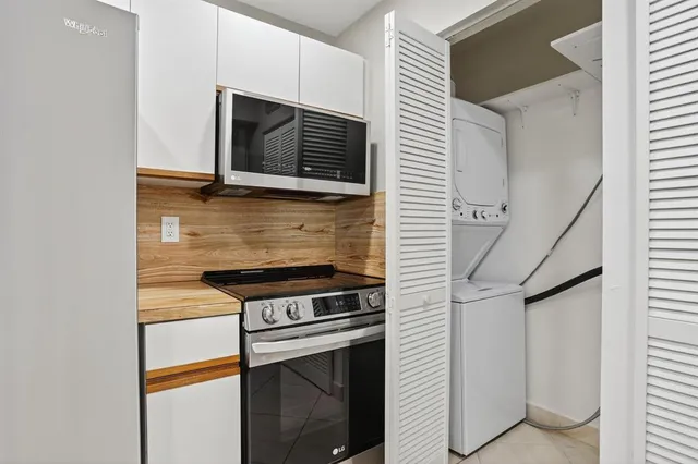 a view of a living room with a refrigerator
