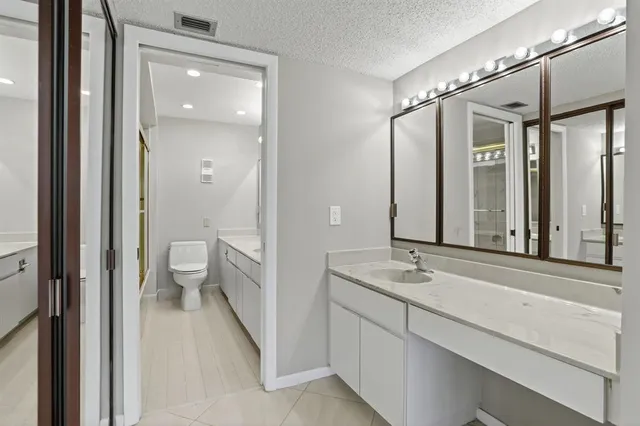a view of a livingroom with furniture and a potted plant
