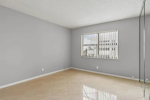 a view of a swimming pool with sitting area