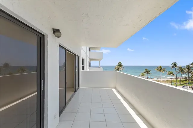 a view of a swimming pool with a lounge chairs