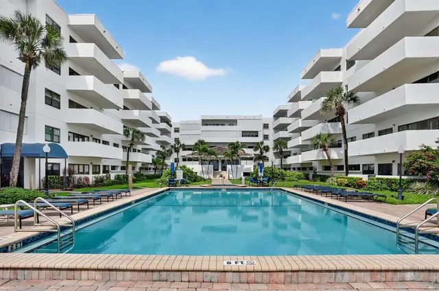 a kitchen with stainless steel appliances a refrigerator and a stove top oven