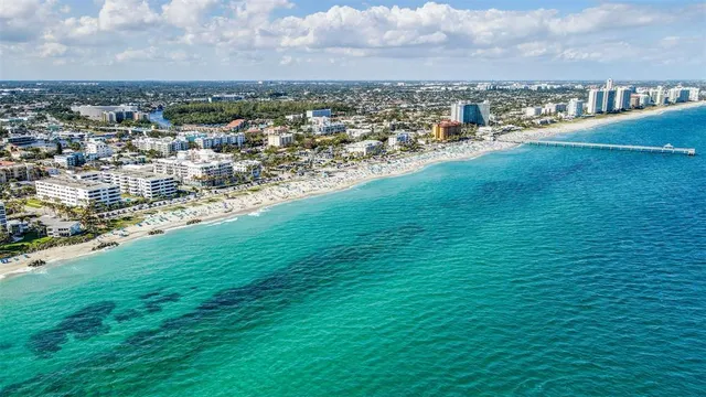 a view of a swimming pool with a lounge chairs