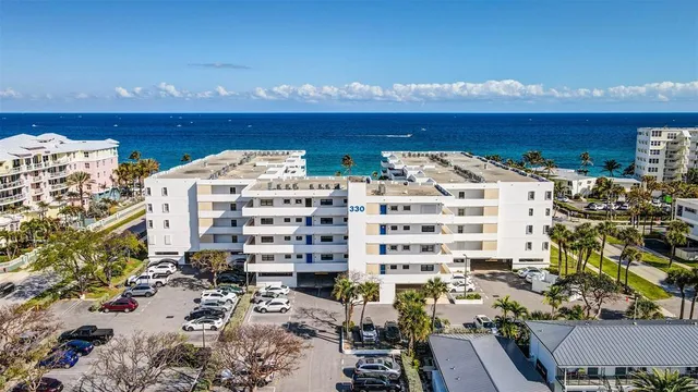 a view of a patio with a table and chairs